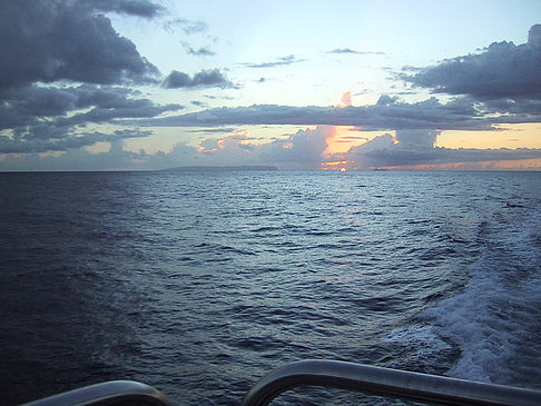 Sonnenuntergang über dem Meer von Kauai Fotos